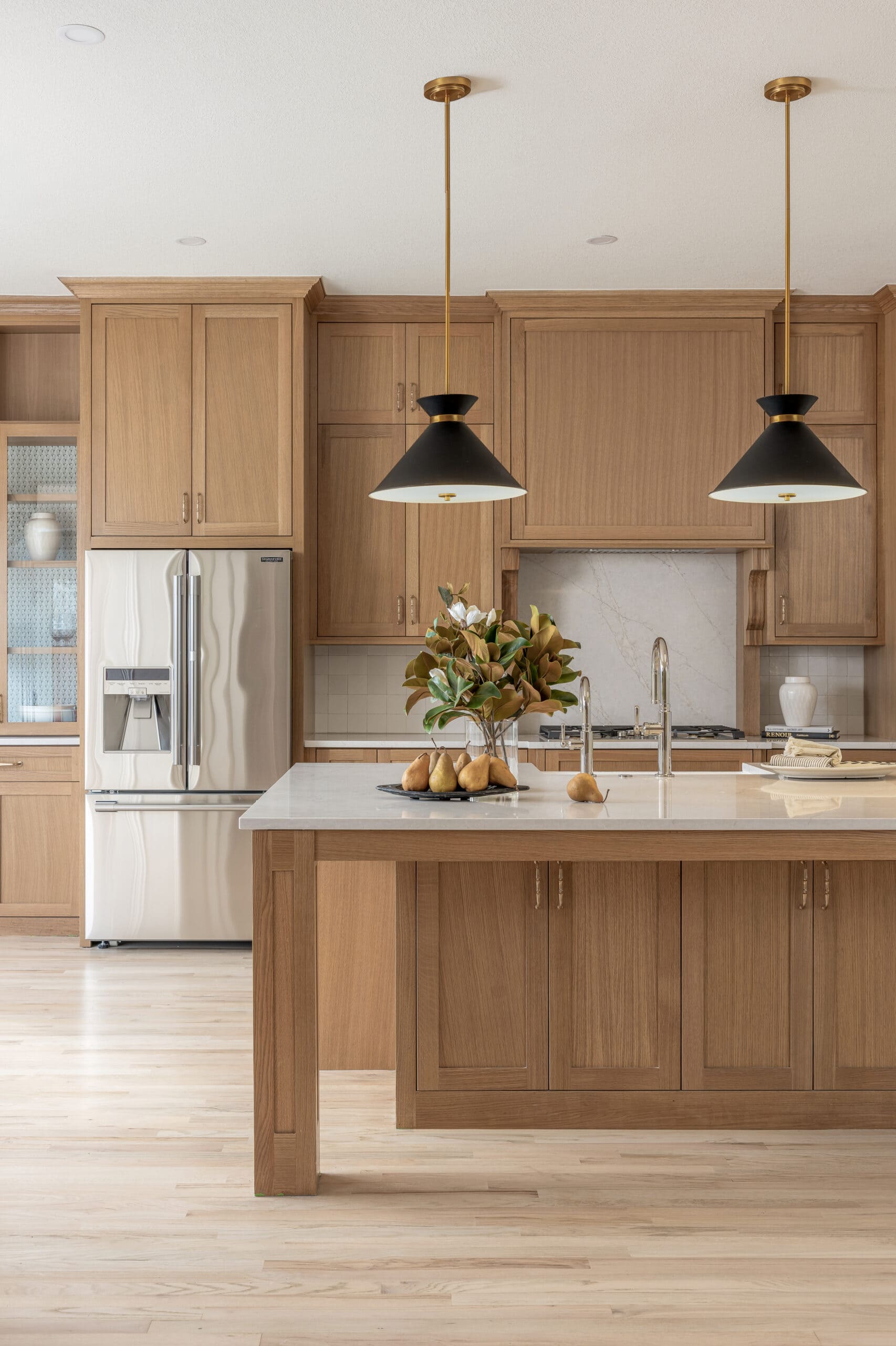 Warm oak kitchen with a stone island