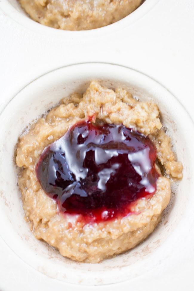 Whole-Wheat Jam Doughnut Muffins - A perfect way to start your morning these healthy layered muffins are bursting with flavor! Vegetarian too!!