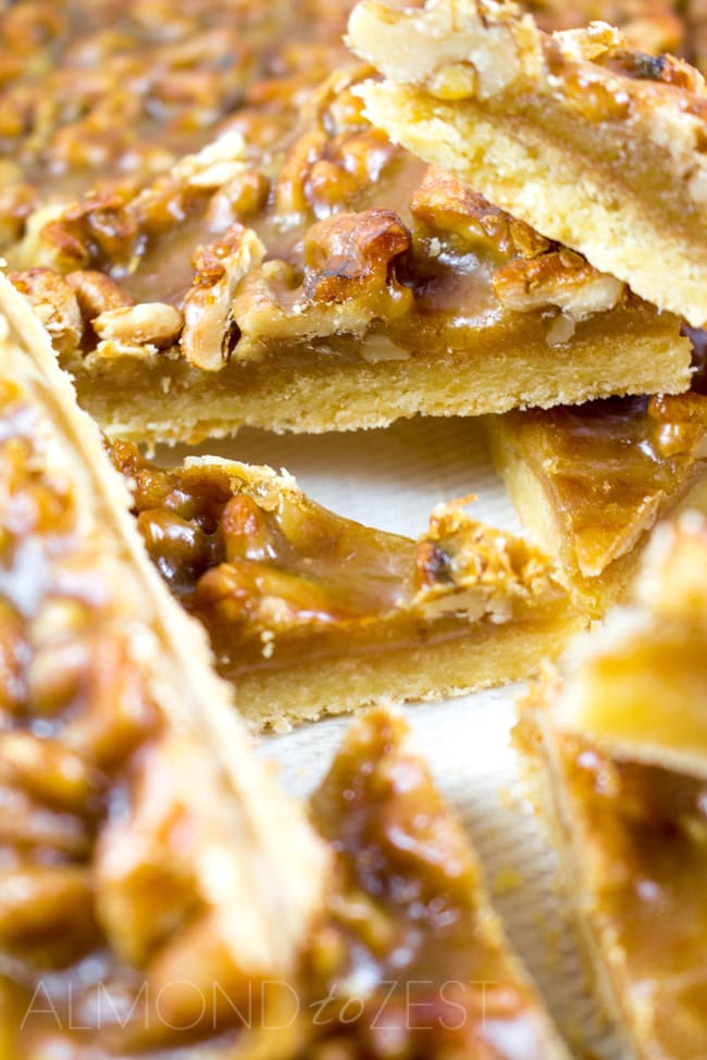 Caramel and Walnut Slice - Super soft, crumbly slice topped with crunchy walnuts and chewy caramel! You HAVE to try this it's crazy good!!