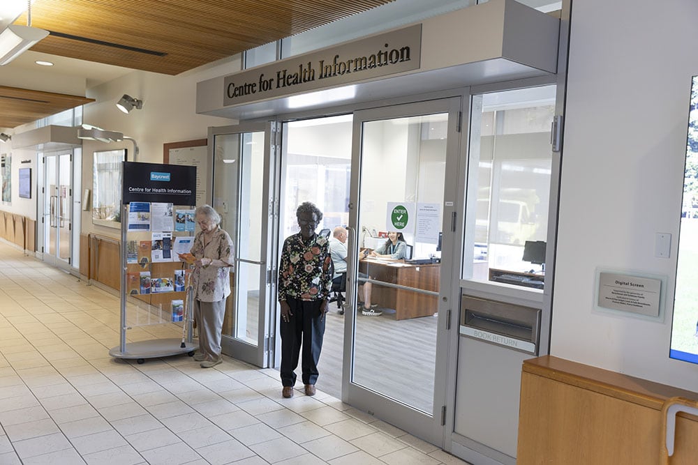 An older adult standing at the door way for the Centre for Health Information