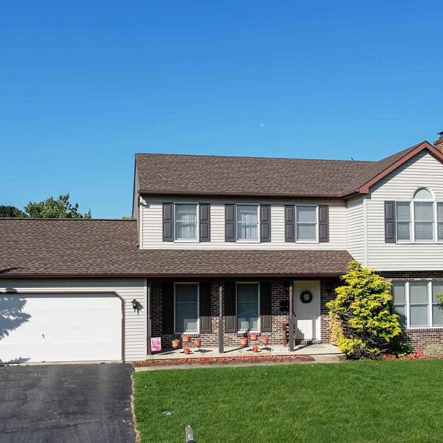 roof repair on brown shingles