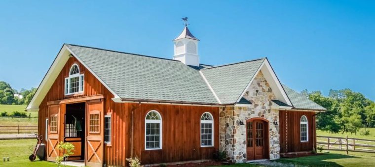 home with wood siding and new roof under blue sky
