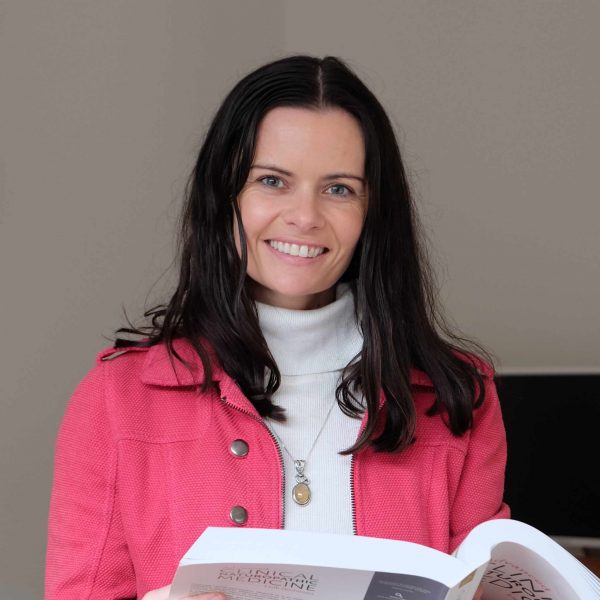 Bridget Love Launceston Naturopath, Bridget Love, holding a book