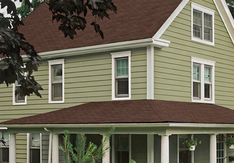 Long lasting green siding on farmhouse