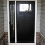 black front entry door wtih transom window on lancaster home