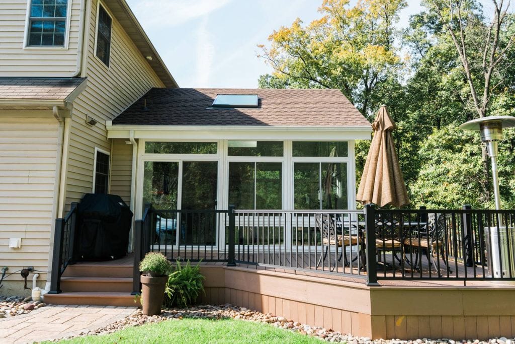 Modern sunroom exterior ideas with beige siding