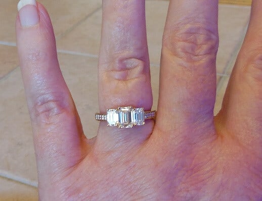 3 stone emerald cut ring