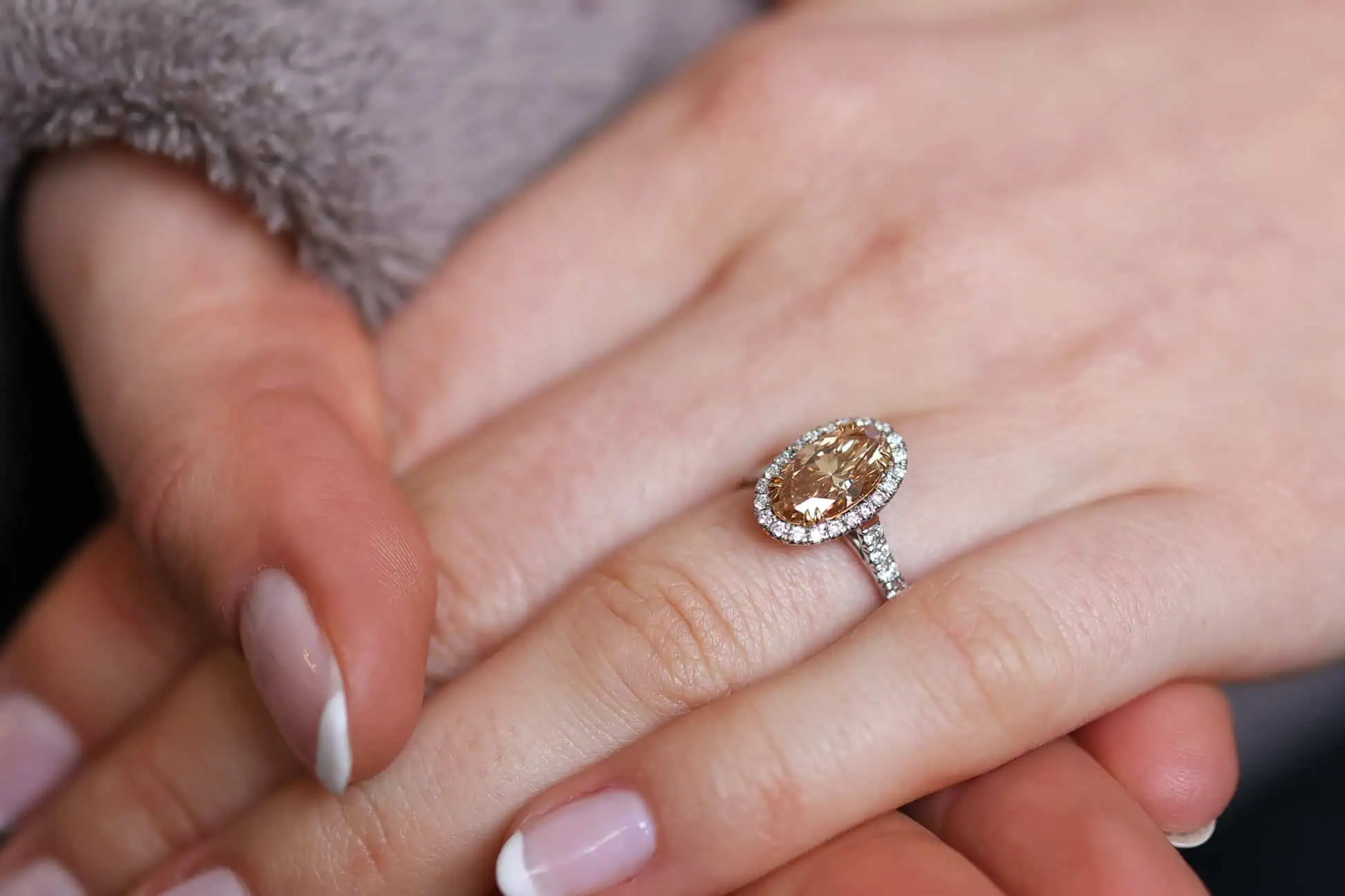 1.71ct champagne oval cut diamond in a halo engagement ring from Abe Mor