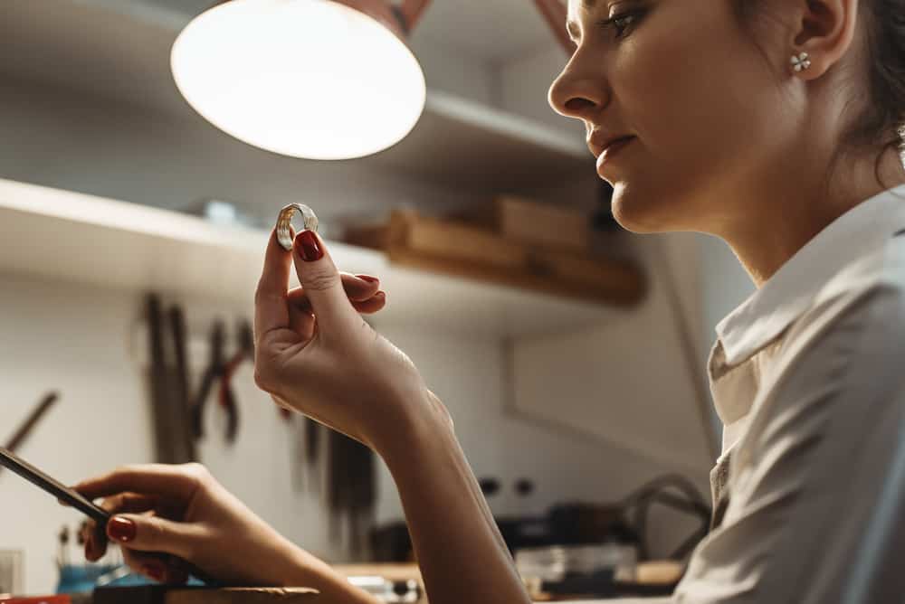 Jeweler wrking on a hand made ring