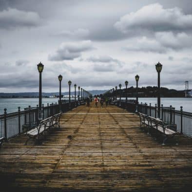 brown-wooden-bridge-near-body-of-water-1024862
