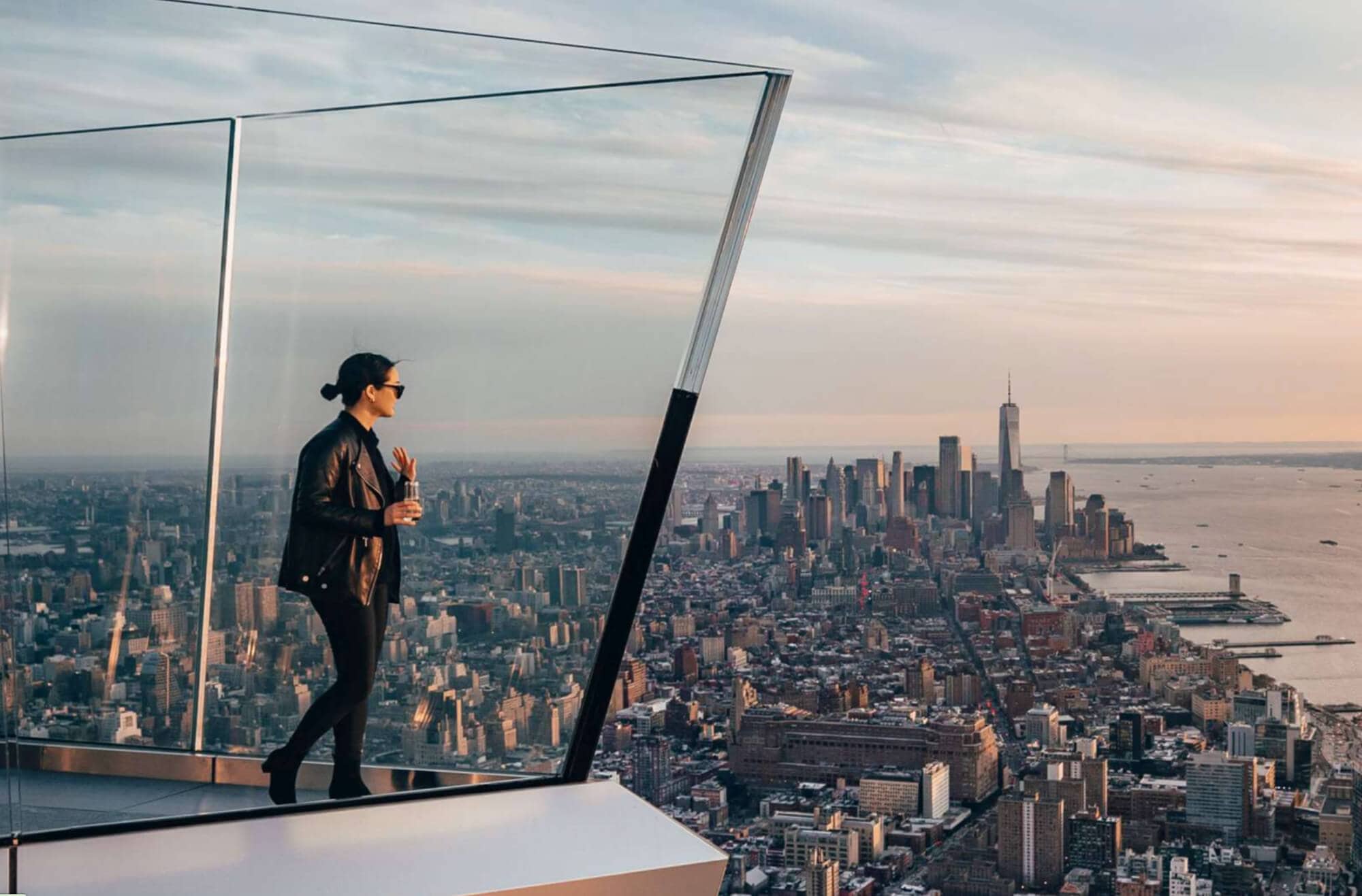 A woman poses at The Edge at sunset