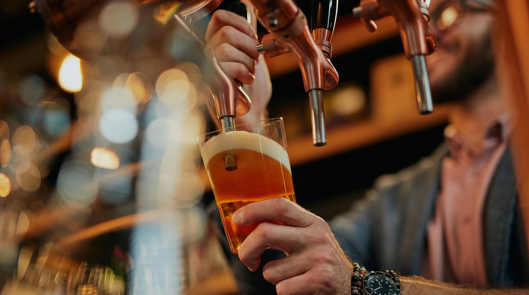 Draft beer being poured into a glass