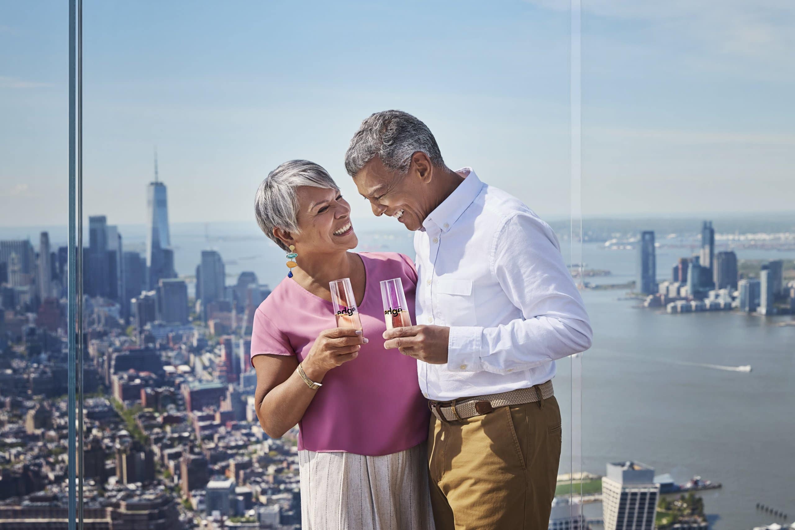 a couple enjoying champagne at The Edge NYC