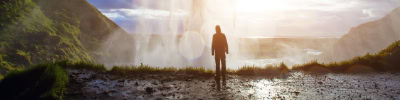 incredible waterfall in Iceland, silhouette of man enjoying amazing view of nature
