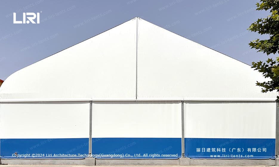 Curved roof event tent with white and blue sidewalls