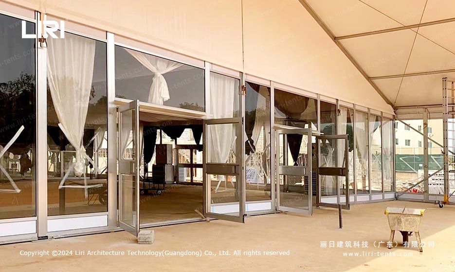Front entrance of polygon event tent with glass doors at Alisa Hotel
