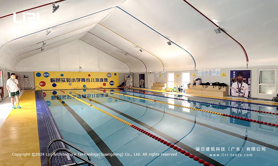 Pool tent interior with swimming lanes and lane dividers