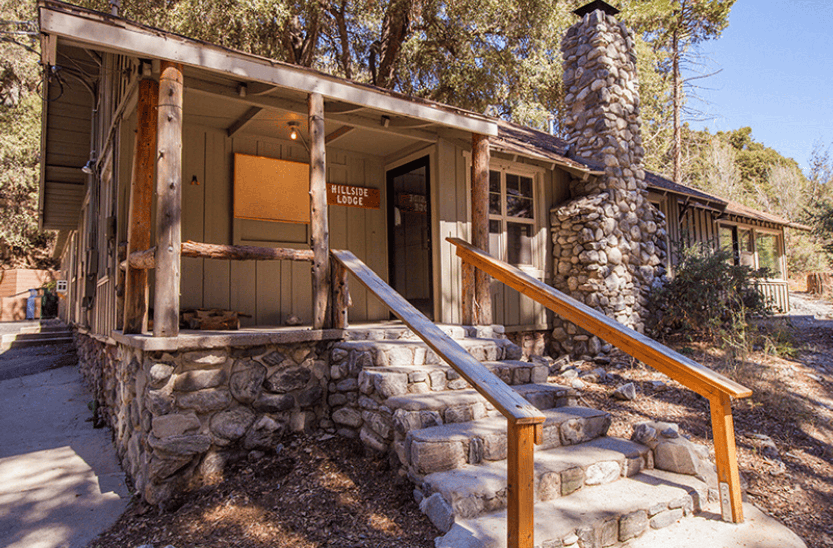 Hillside lodge with steps going up to the front door
