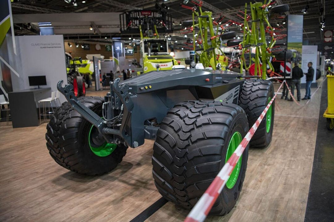 On the Claas stand, a four-wheeled AgXeed autonomous tractor coupled to a tedder is shown. - Photo: Mark Pasveer