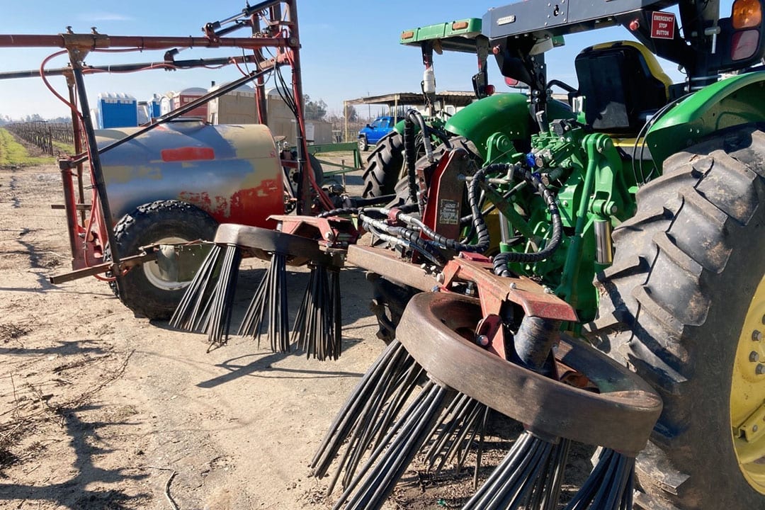 Tractors equipped with berm sweepers. The next step for Mike Harder is to perform spraying autonomously.