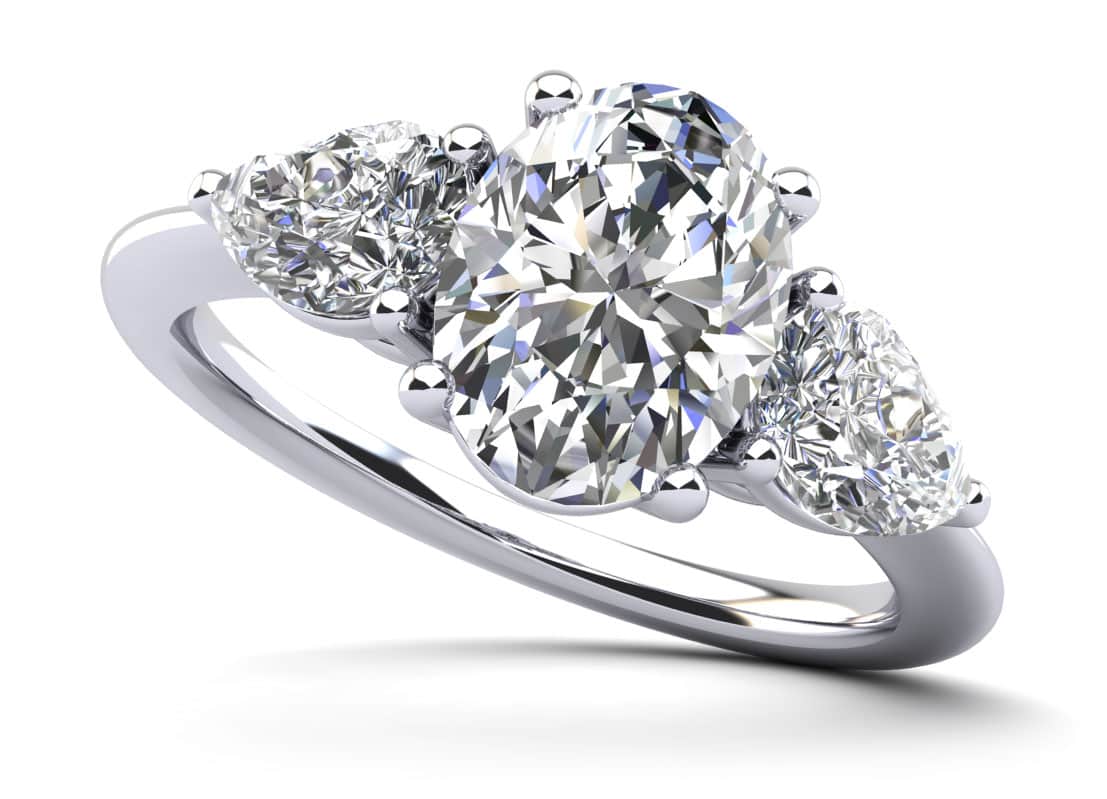 Elegant Three Stone Oval and Pear Diamond Engagement Ring