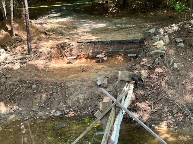 Helical piles for a bridge