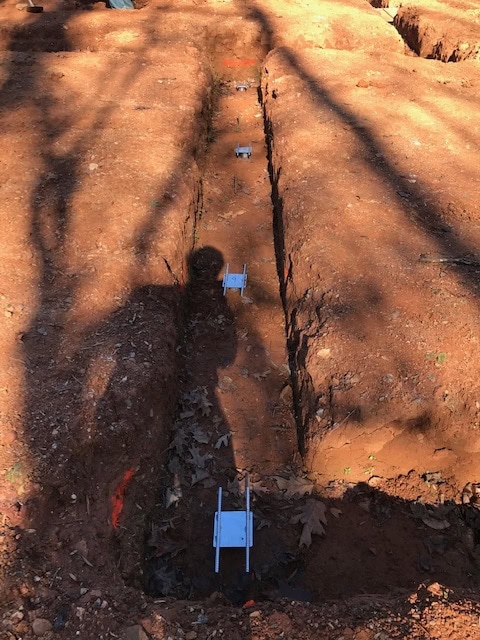 Helical pile in grade beam rotated