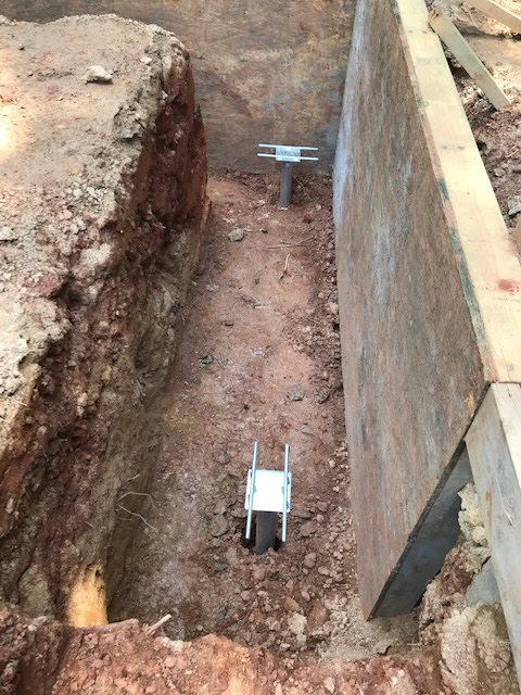 Helical piles in step footing, Charlotte