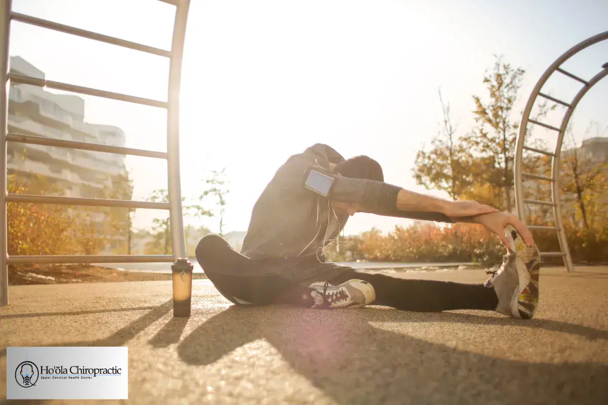 Active athlete stretching outdoors for sports injury recovery