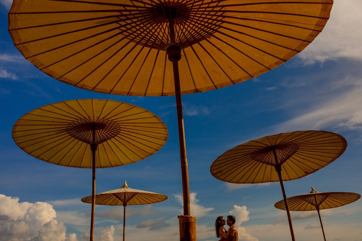 Destination wedding with umbrellas in Phuket, Thailand by Julian Abram Wainwright