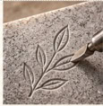 Carved floral memorial inscription