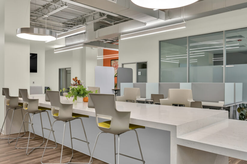 Modern coworking office space with bright lighting and open layout at Office Evolution.