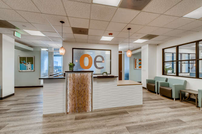 Office evolution welcoming reception area with modern design and seating options.