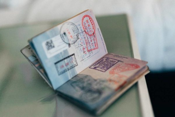 A persons' passport on a table for their move internationally