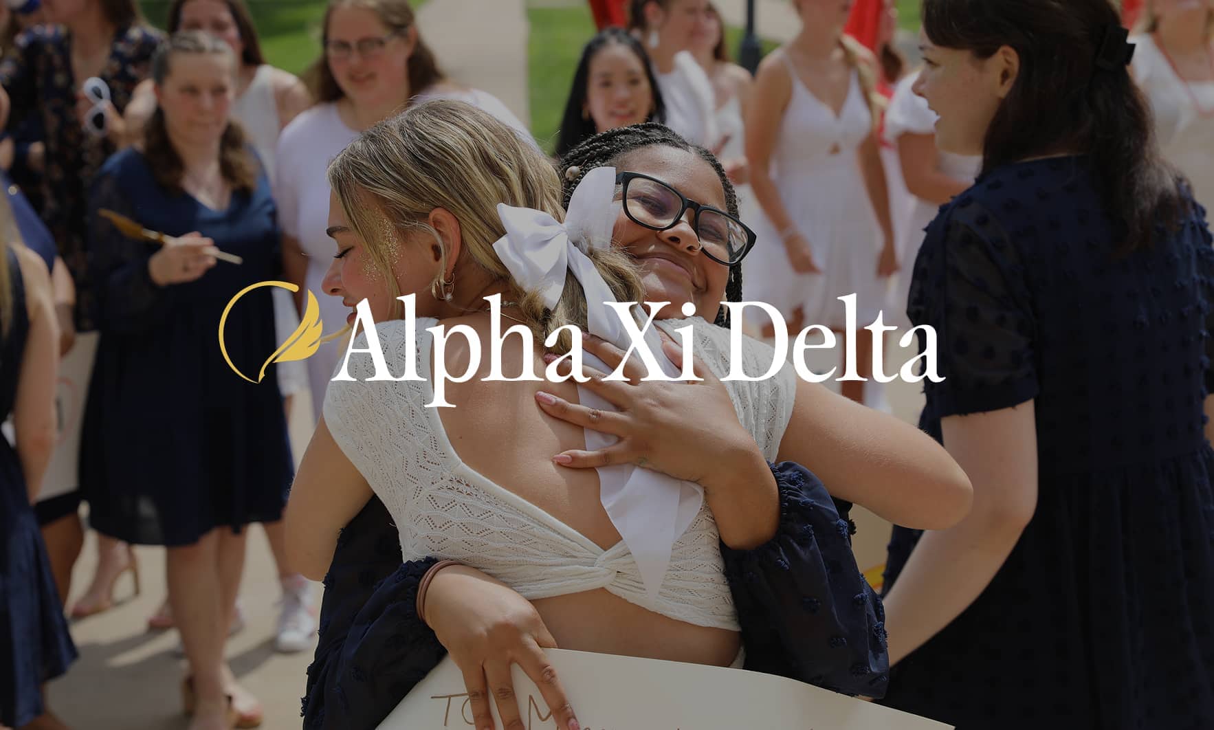Alpha Xi Delta Sisters Hugging Over Logo