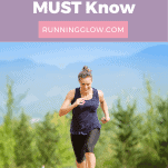 woman running on a track with mountains in background