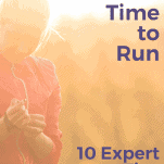 female runner adjusting watch before run