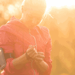 female runner adjusting watch