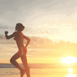 female runners legs in the hot weather and at sunrise