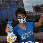 female runner rundisney virtual race castle with medal