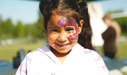 A child participates in a community event at Grassy Narrows First Nation / Asubpeeschoseewagong Netum Anishinabek in Canada.