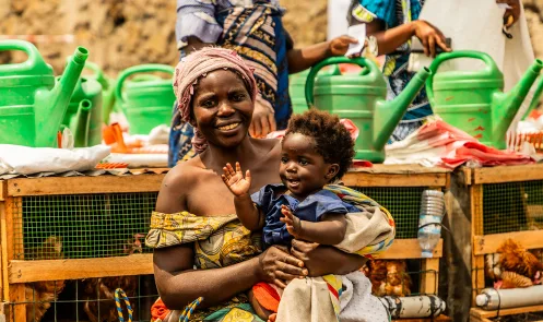 Brigitte, 30, & Cecile, 5 months at a distribution site in DRC