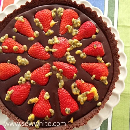 ready to serve the Chocolate tart with Strawberries and drizzled with Passion Fruit 