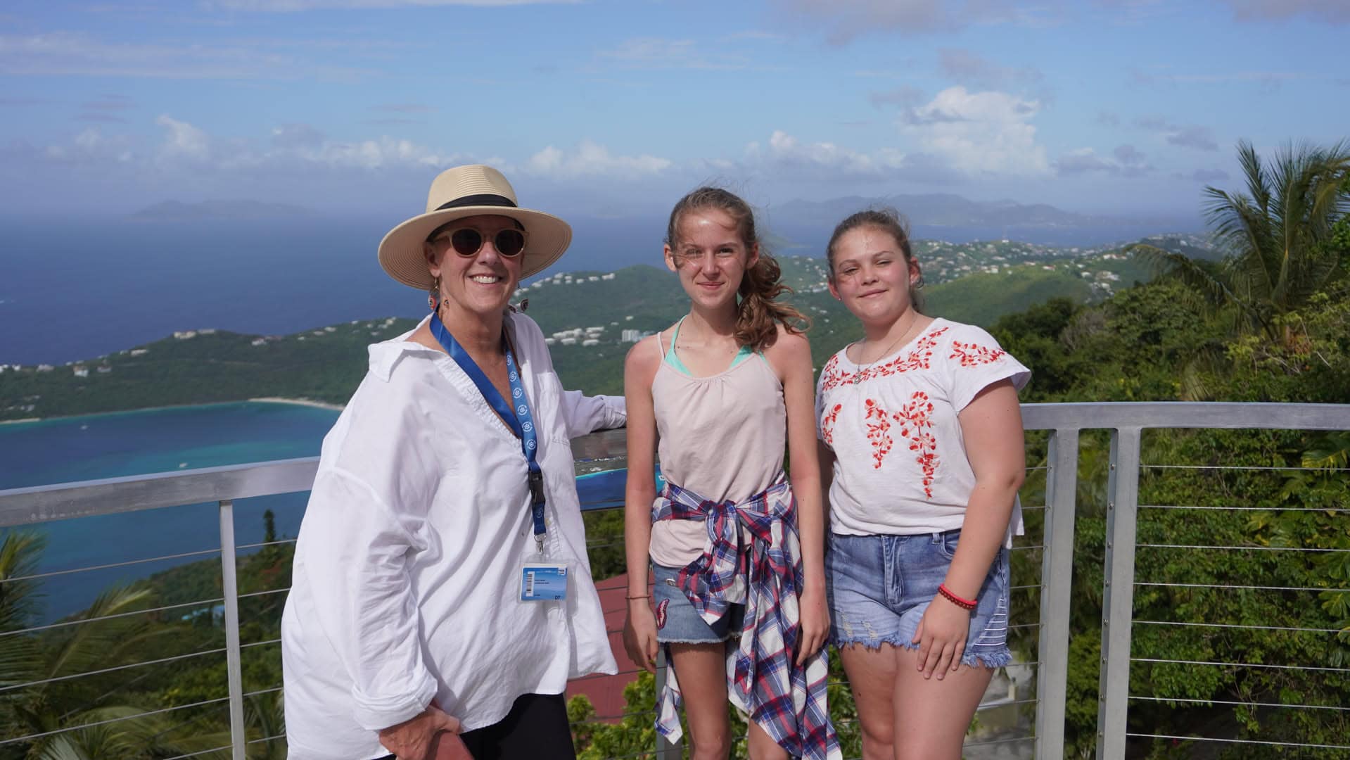 A family enjoying a coastal overlook on a past cruise