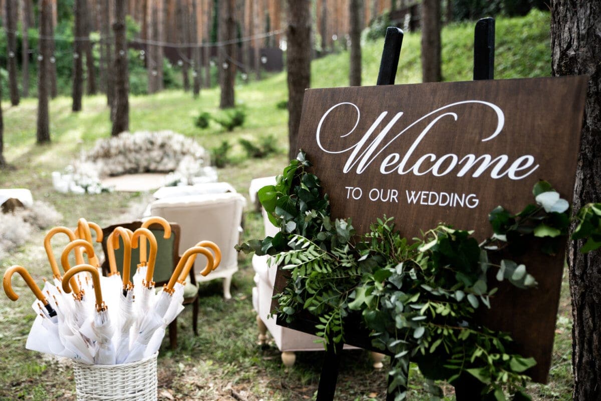 Wooden board and umbrellas for wedding