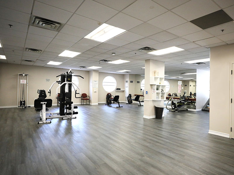 Fitness room with exercise equipment at Two Neptune Drive.