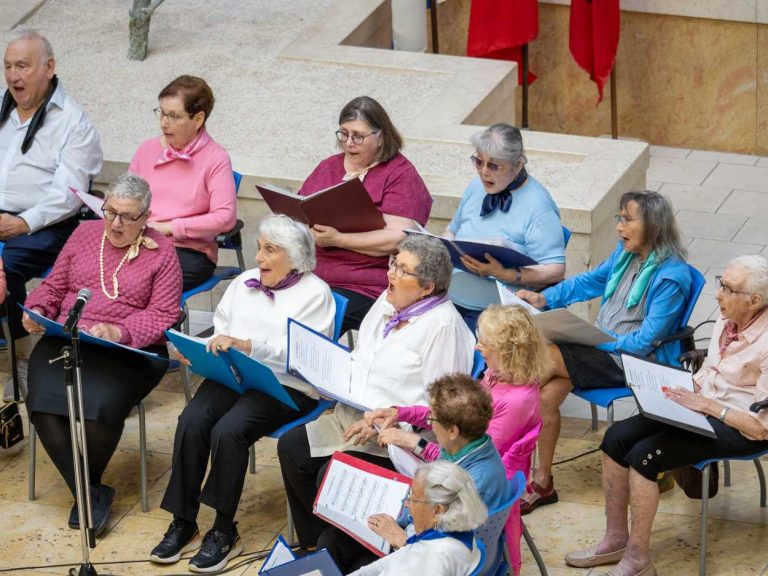 Two Neptune Drive residents performing with the resident choir.