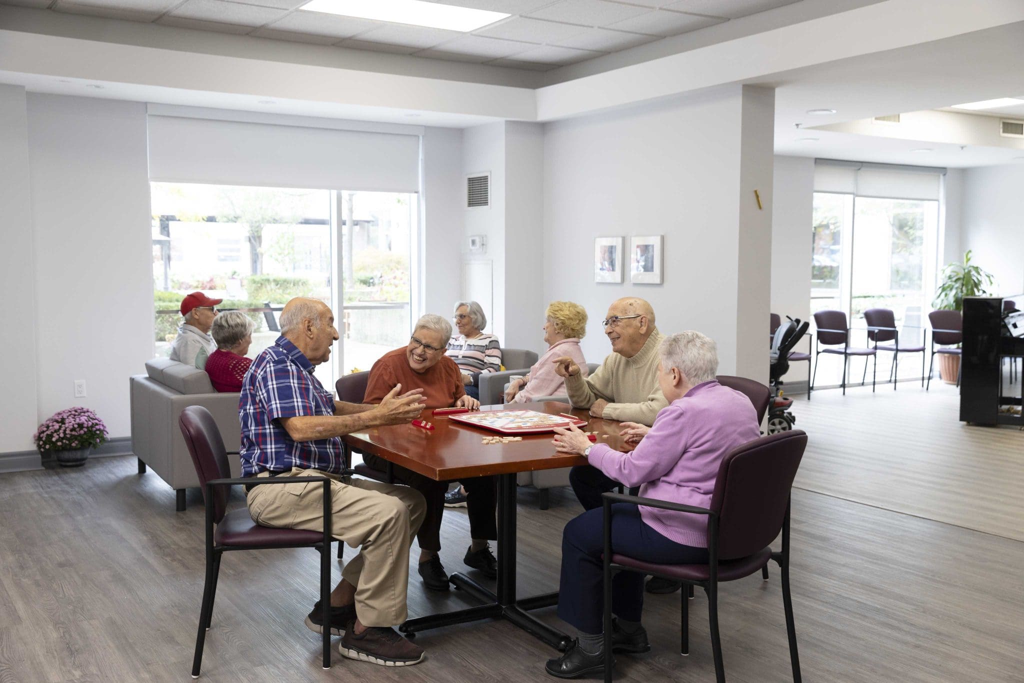 Residents socializing and playing games together at Two Neptune Drive.