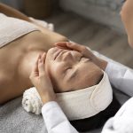 high-angle-woman-getting-massaged-spa (1)