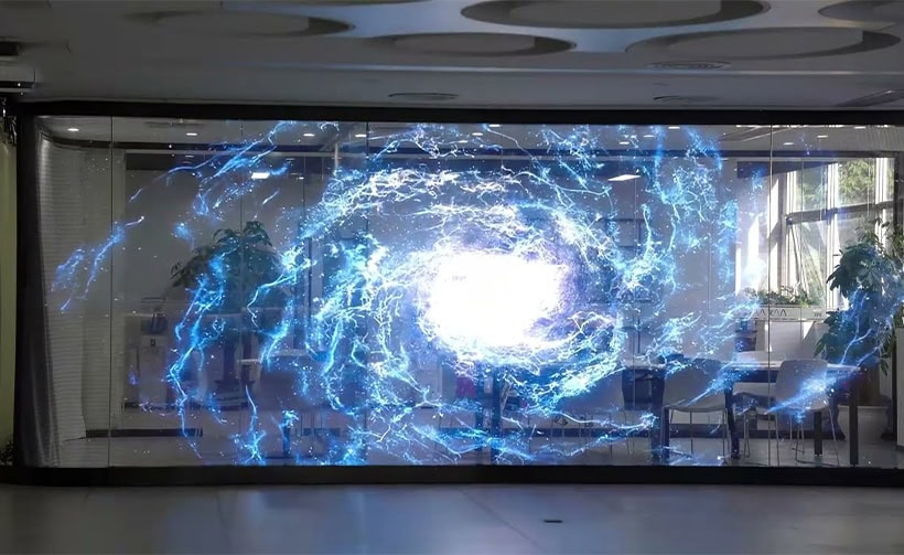 InviAir holographic transparent LED screen creating immersive blue energy visual effects on glass in a modern indoor space